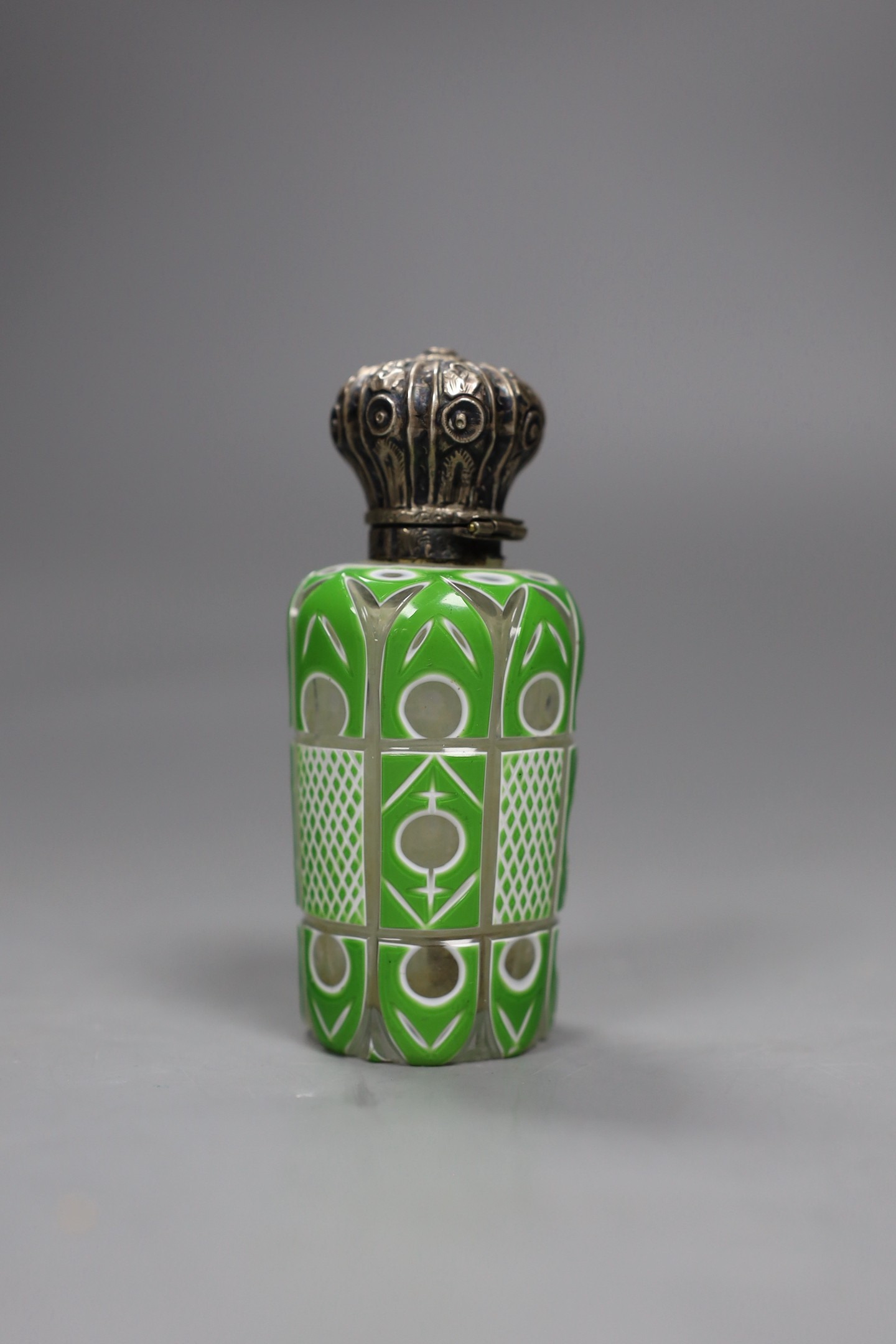 A Victorian silver mounted green and white overlaid glass scent bottle, 10cms high